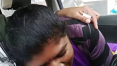 Telugu woman gives a desi blowjob to her man in a car