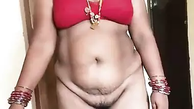 Tamil milf strips and gets naked before her Nephew