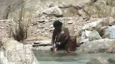Lady open air bathing in River by
